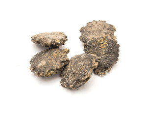 Five gac seeds (momordica cochinchinensis) isolated on white background