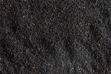 Black small-leaf tea, background. Copy space.