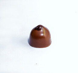 One, separate chocolate candy on a white background up close