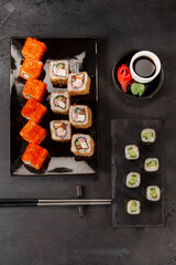 Slide motion of sushi food served on black stone