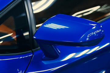 Fototapeta premium side rear-view mirror on a modern car