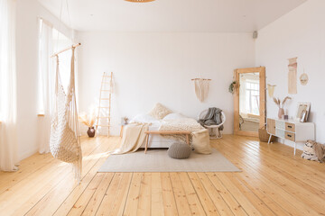 cute cozy light interior design of the apartment with a free layout of the kitchen and bedroom...
