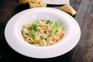 Parmesan pasta in a white plate