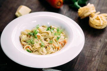 Parmesan pasta in a white plate