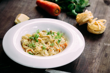 Parmesan pasta in a white plate