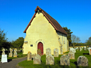 Fototapeta na wymiar A tiny church with a cemetery