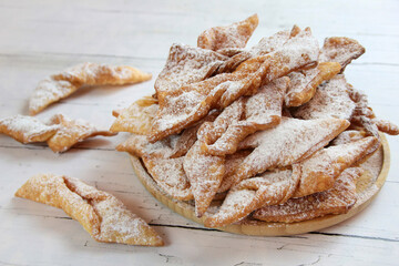 Faworki (angel wings) sprinkled with powdered sugar - traditional Polish carnival delicacy
