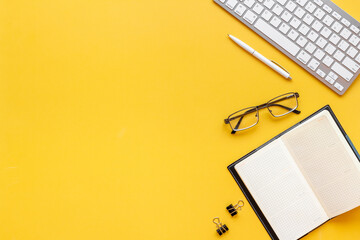 Top view of office desk - workspace with keyboard and office supplies