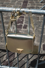 Festive evening golden handbag. Luxury accessories and party concept.