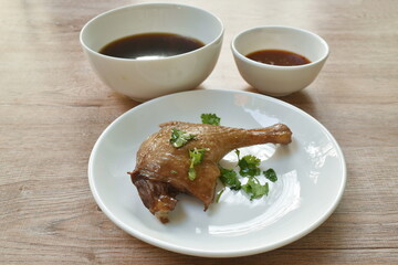 boiled duck leg in black soybean sauce dipping spicy chili sauce