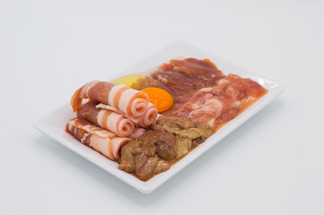 raw meats on a plate