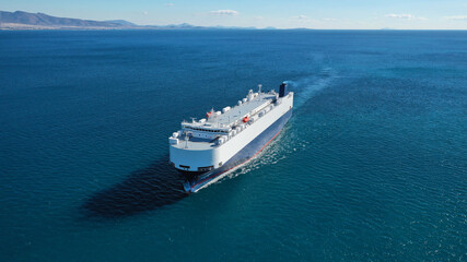 Aerial drone photo of Large RoRo (Roll on-off) car transportation vessel cruising the Mediterranean deep blue sea