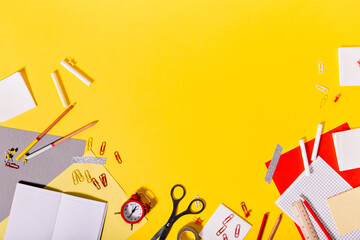 Creative mess of colorful school supplies on desk