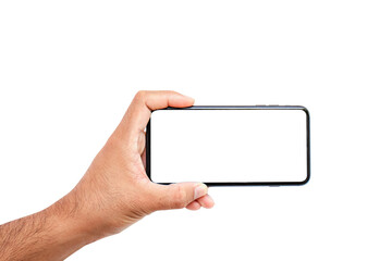 The hand is holding a cell phone with a white screen and white background.