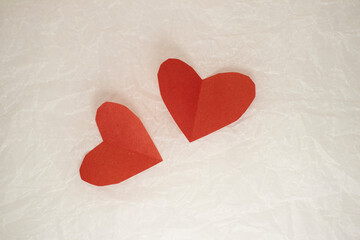 Fototapeta premium valentine's day cards on white crumpled paper. valentines on a crumpled background with a place for an inscription