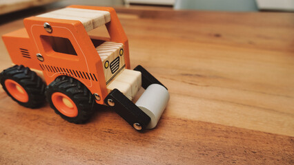 Fototapeta premium Toy truck on wooden table