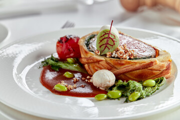 Easter meat roll, meatloaf for Easter dinner. Beautifully decorated catering banquet table with different food snacks and appetizers