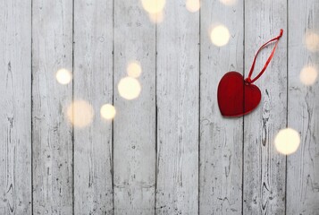 Valentine's Day photo with glass hearts on brick wall background. 