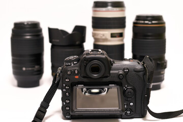 
Photo camera with lens on white background