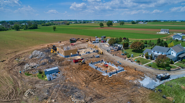 Aerial View Of An Amish Barn Raising After A Large Fire Destroyed Them On A Beautiful Summer Day