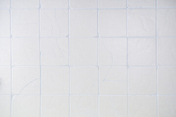 Old kitchen tile wall background. Matte beige cream tiles top view
