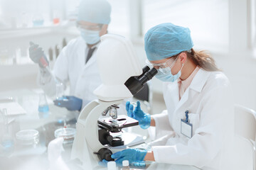 laboratory technician conducts testing in the laboratory . - 405830569
