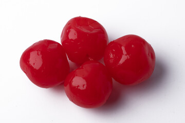 Fresh red candied cherries on a white background