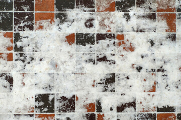 fragment of a paved sidewalk covered with snow
