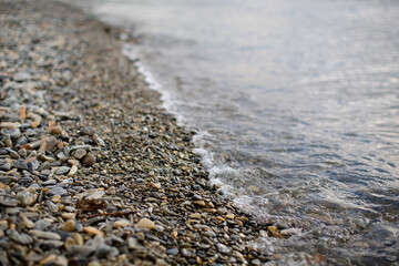 Pebbles on the beach on the sea