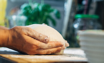 hand holding bread dough