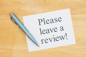 Please leave a review note with a pen on a desk