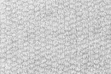 White natural texture of knitted wool textile material background. White cotton fabric woven canvas texture