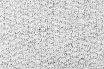 White natural texture of knitted wool textile material background. White cotton fabric woven canvas texture