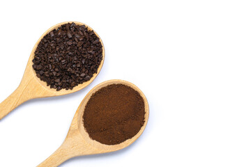 Closeup instant granulated coffee and coffe dust powder in wooden spoon isolated on white background. Top view. Flat lay.