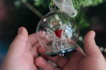 hand with christmas ball