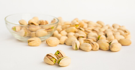 roasted pistachios on white background