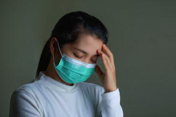 Portrait of a woman wearing an Anaamai mask To prevent germs On black background