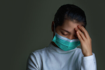Portrait of a woman wearing an Anaamai mask To prevent germs On black background