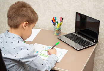 Distance learning child during self-isolation. Drawing lesson online