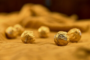 Chocolate pralines wrapped in gold foil