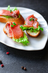 sandwich salmon fish bruschetta with seafood antipasto aperitif ready to eat on the table for healthy meal snack outdoor top view copy space for text food background image rustic diet pescetarian