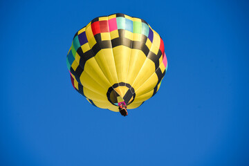 I captired this image one morning this past fall. You can see how the sky would change color as I took pictures from different angles, Hot air balloon floating free.