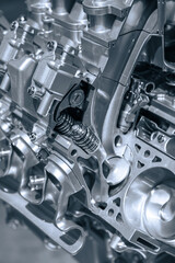 Cut section of automotive engine in monochrome
