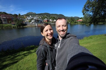 Fototapeta premium Norway couple travelers in Forde. Summer active vacation.