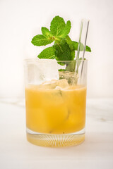 Mai Tai Cocktail and Tiki Drink in a Tumbler on the Rocks Garnished with Mint Sprig