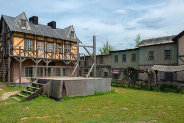 Empty scaffold with a place for execution and wooden gallows. Architecture houses of the European...