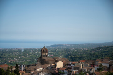 View of the village of Sant 'Alfio from the top of the Etna volcano with the Ionian coast in the...