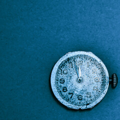 close-up of vintage watches on empty background. the clock shows three minutes to midnight. the new day coming concept. with copyspace for text.