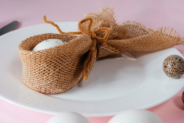 Easter table setting on light bink background