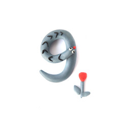 Number 9 made from colorful plasticine isolated on white background. Learning numbers with child.
